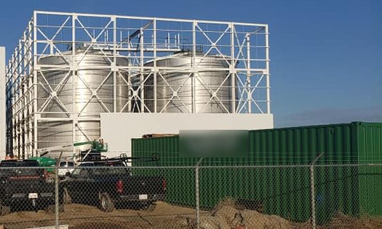 Finished white tank support steel around the tanks at the plant